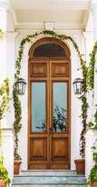 Cta brown wooden door with green plants 3678919  1   1 